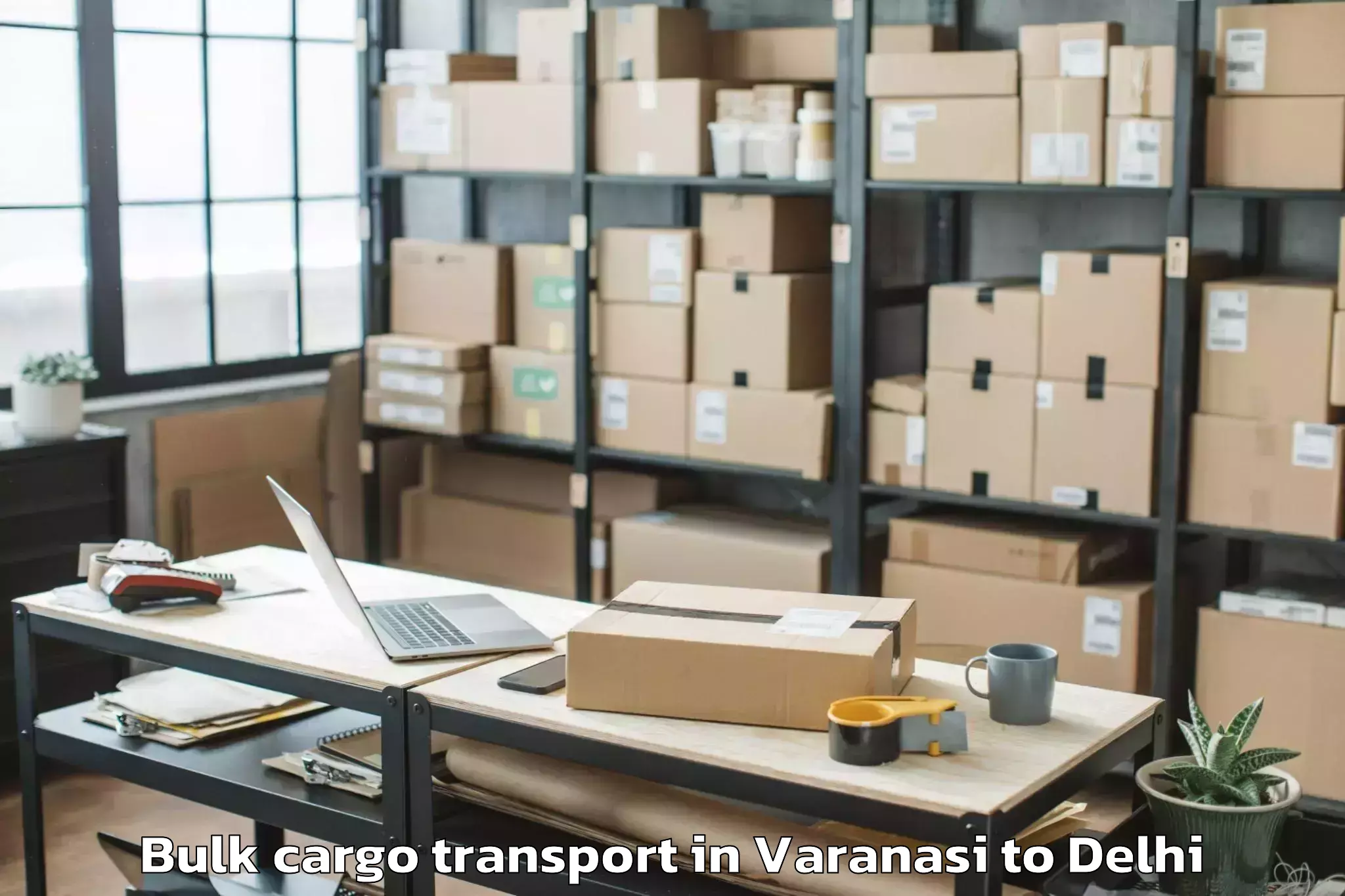 Book Varanasi to Unity One Janakpuri Mall Bulk Cargo Transport